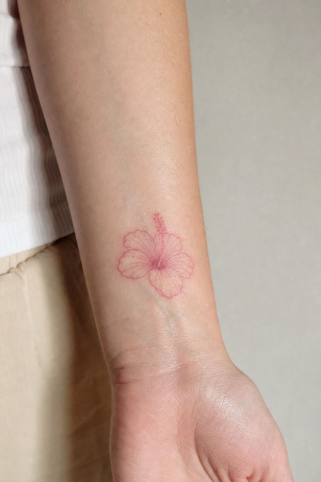 Pink Fine Line Hibiscus Wrist Tattoo