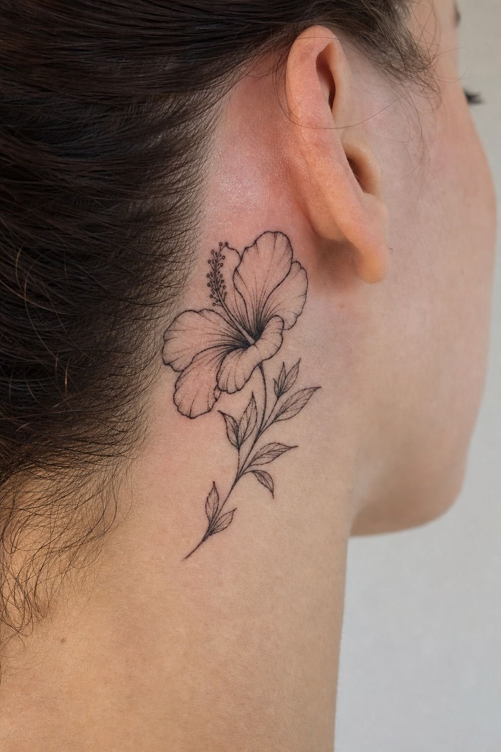 Minimal Hibiscus Behind Ear Tattoo