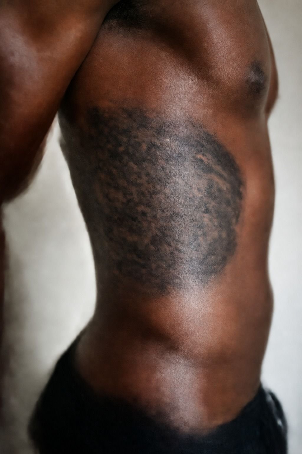 The blackwork cover-up that hid a faded tribal band