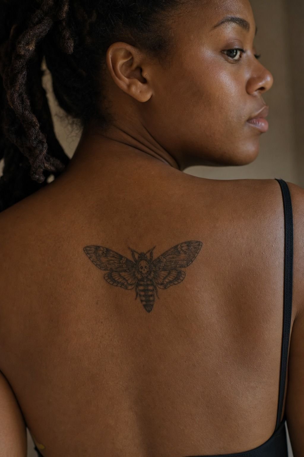 Place Deathhead Moth Tattoo Between Shoulder Blades
