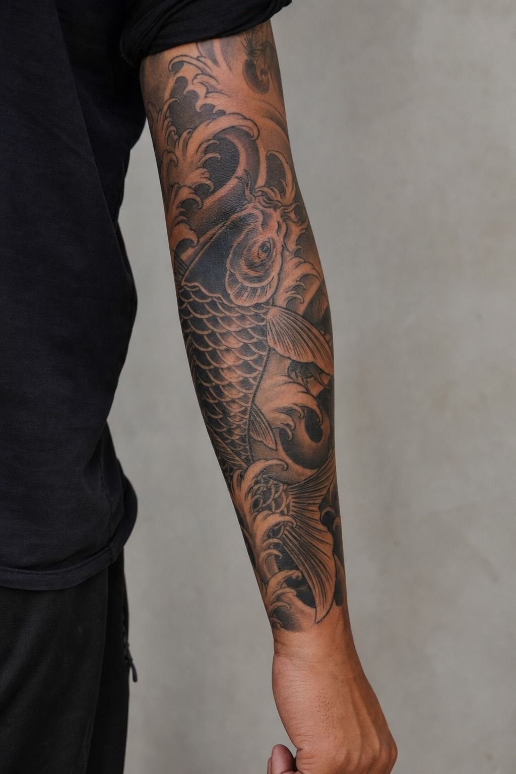 How I adapt Japanese koi into modern blackwork sleeves