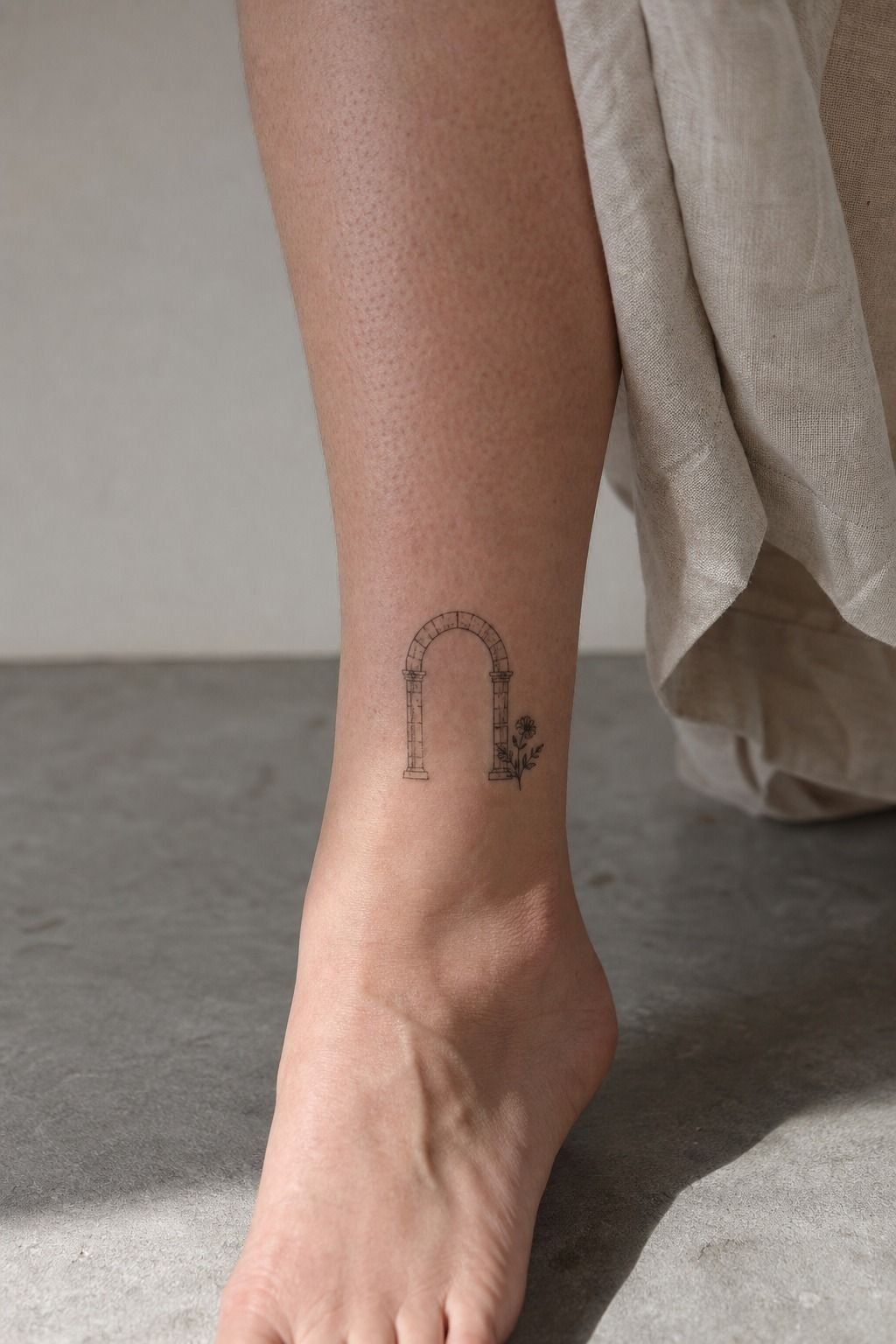 Place a small memorial symbol beside the arch
