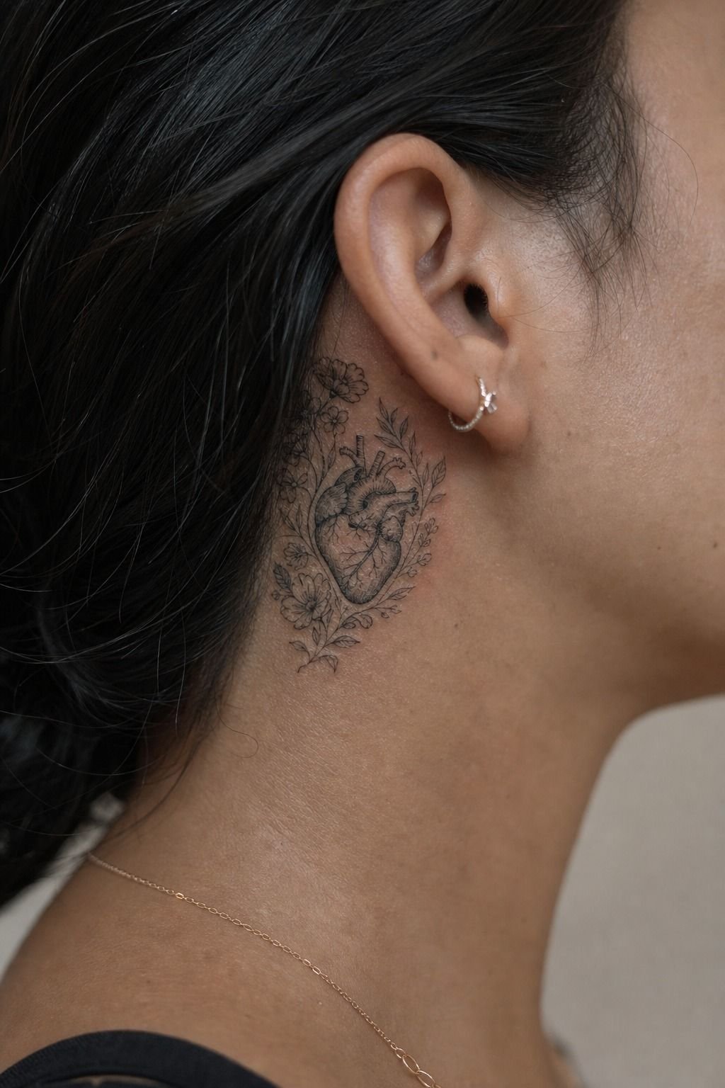 Human Heart Tattoo With Floral Surroundings