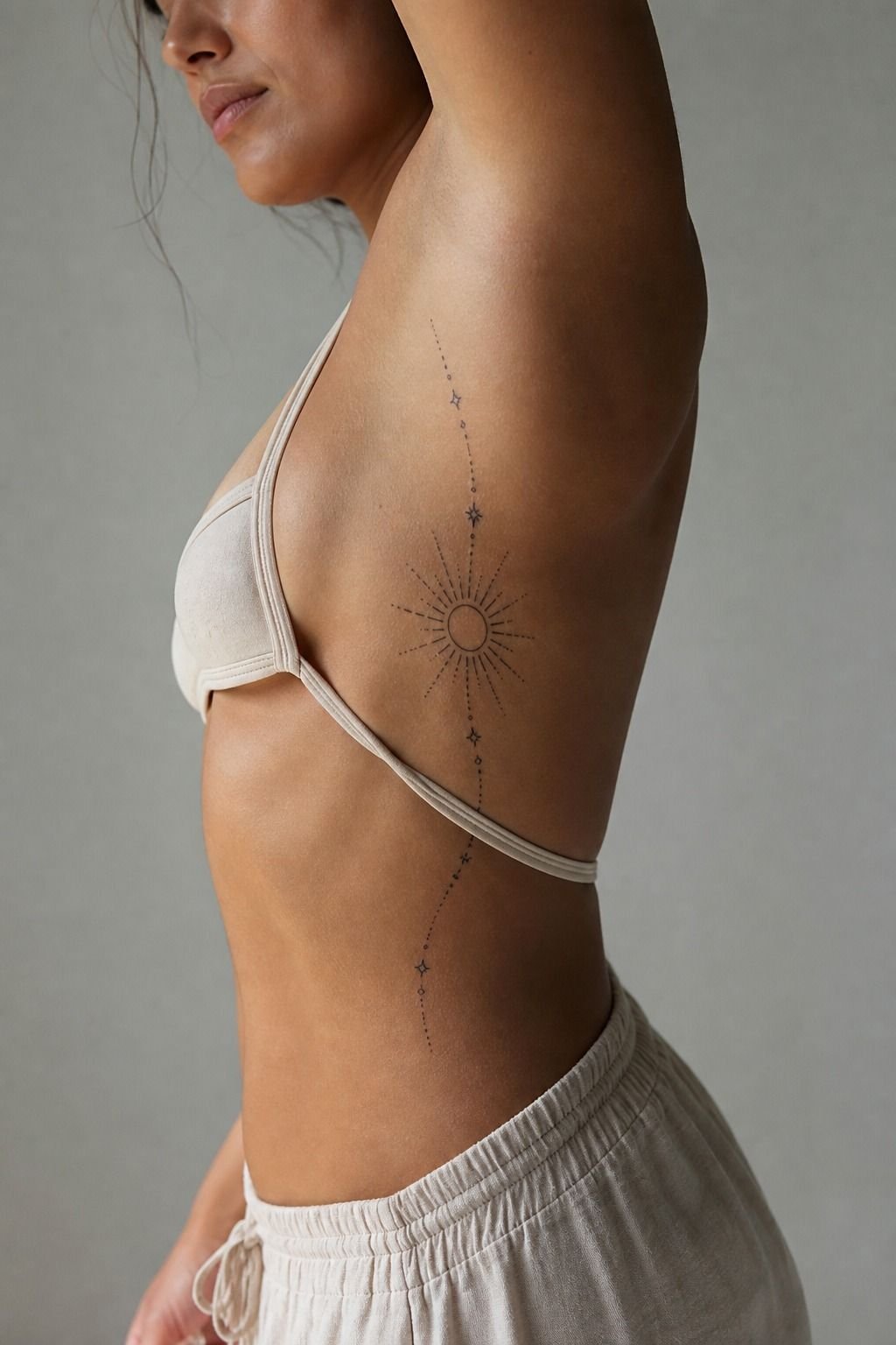 Sun Line Tattoo Along The Ribcage