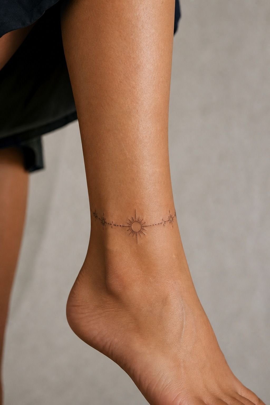 Tiny Sun Tattoo On The Ankle
