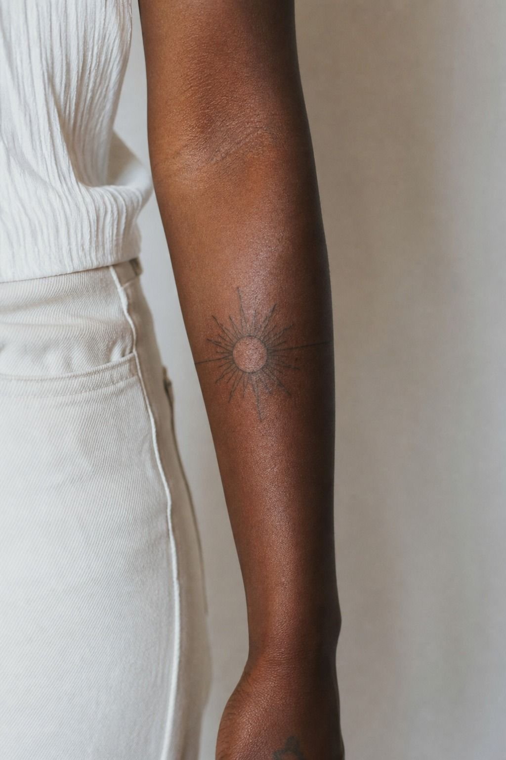 Sun Tattoo Wrapped Around The Forearm