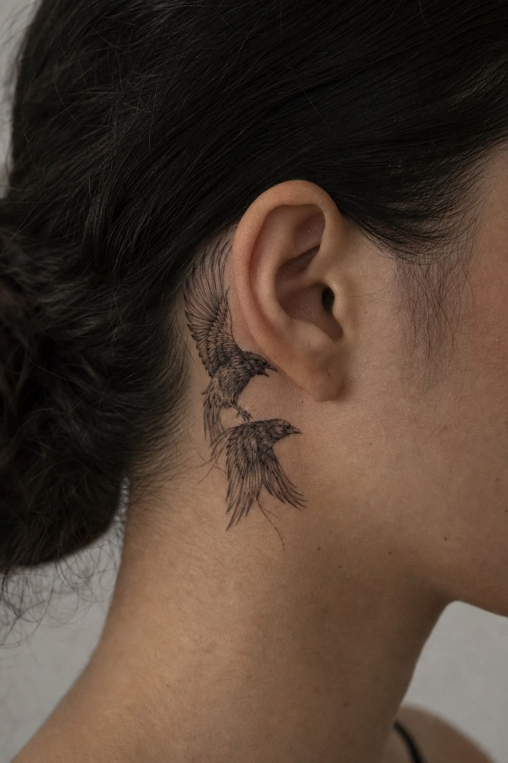 Minimalist Odin’s Ravens Tattoo Behind The Ear