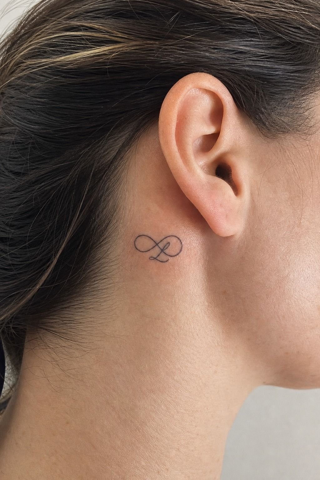 Matching Infinity Tattoos With Daughter’s Initial