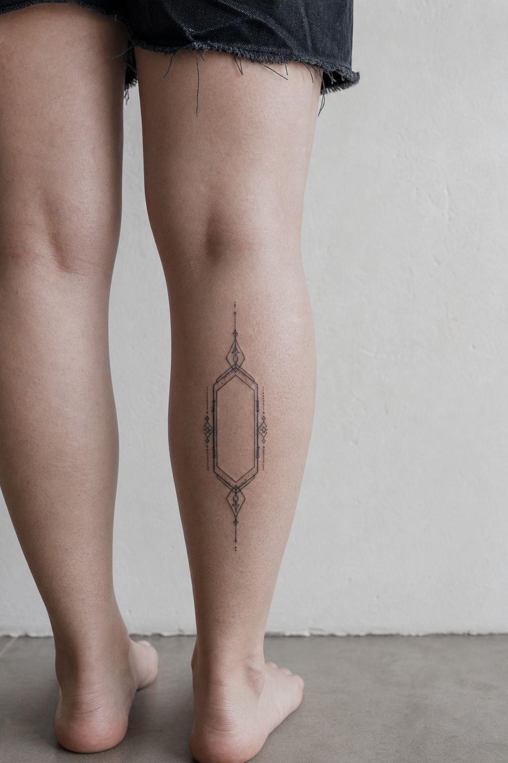 His Name Tattoo Inside a Geometric Frame
