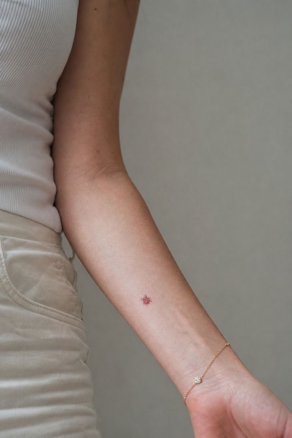 Tiny Red-Ink Ladybug on the Wrist