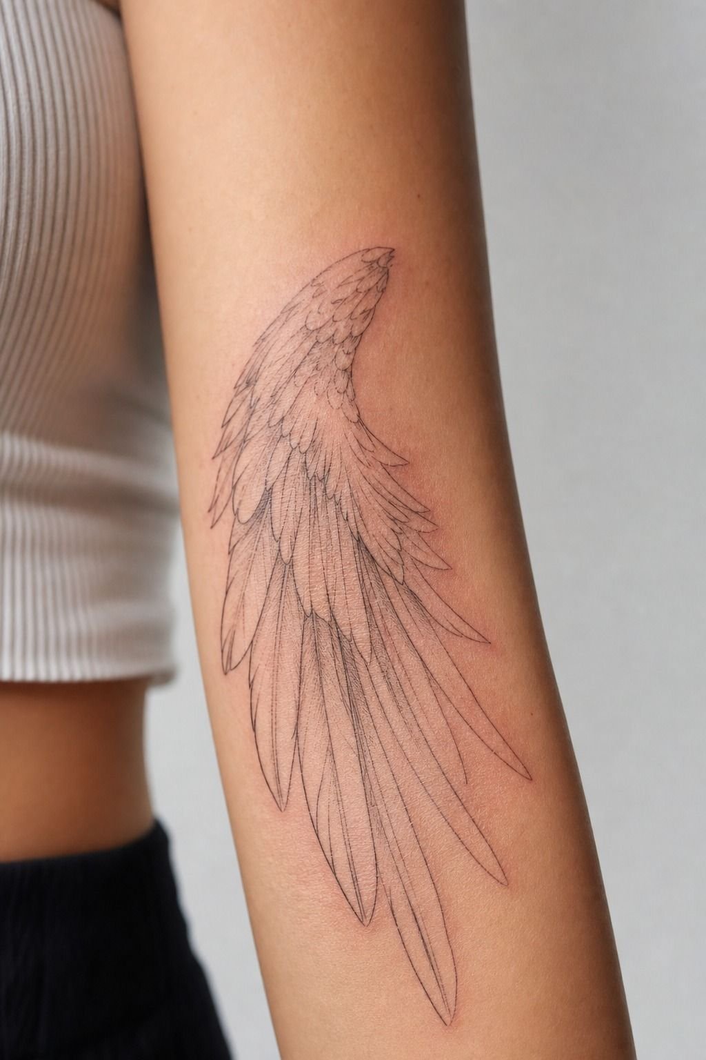 Pick Fine-Line Wings for a Feminine Forearm