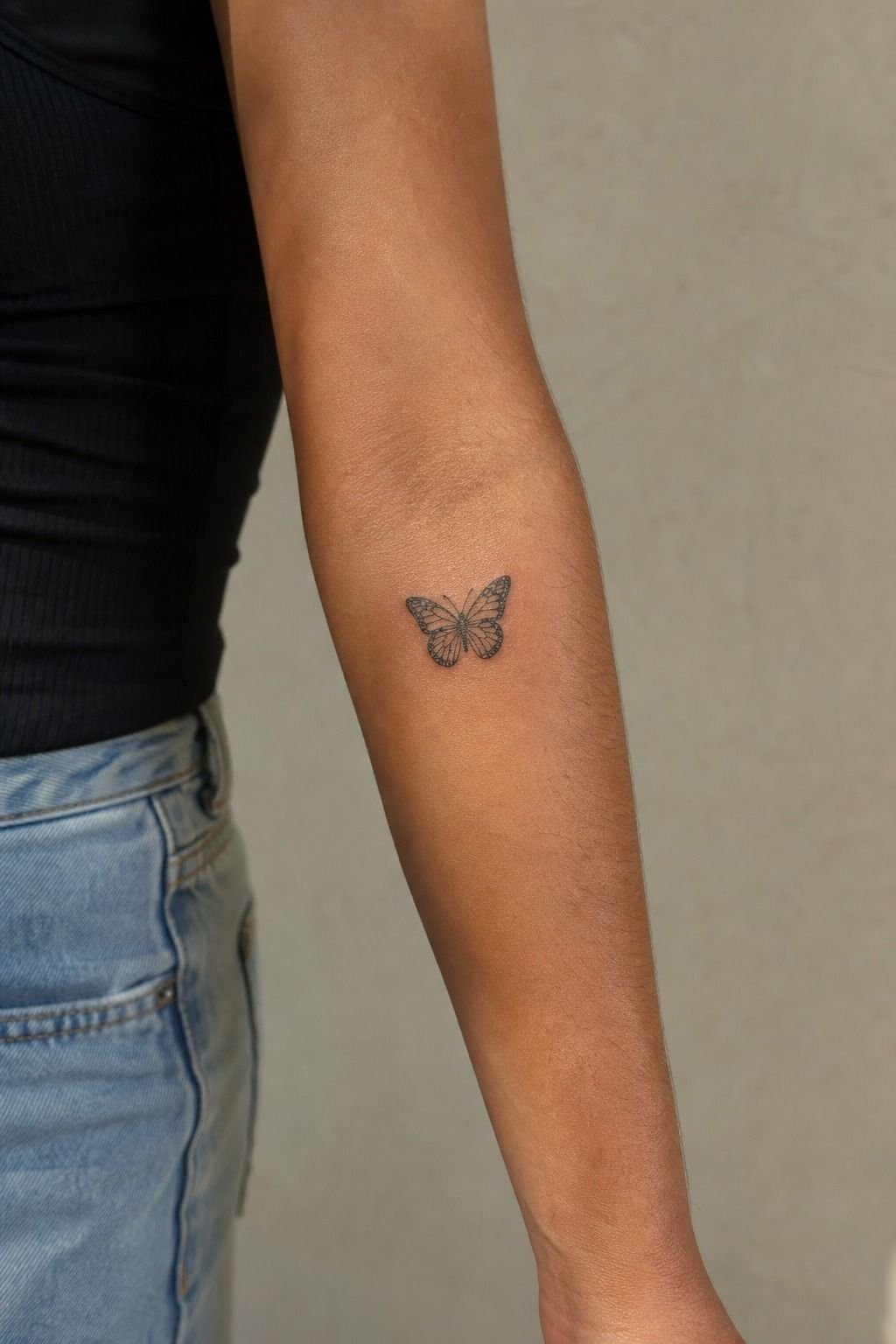 Place a Black Butterfly Above the Elbow