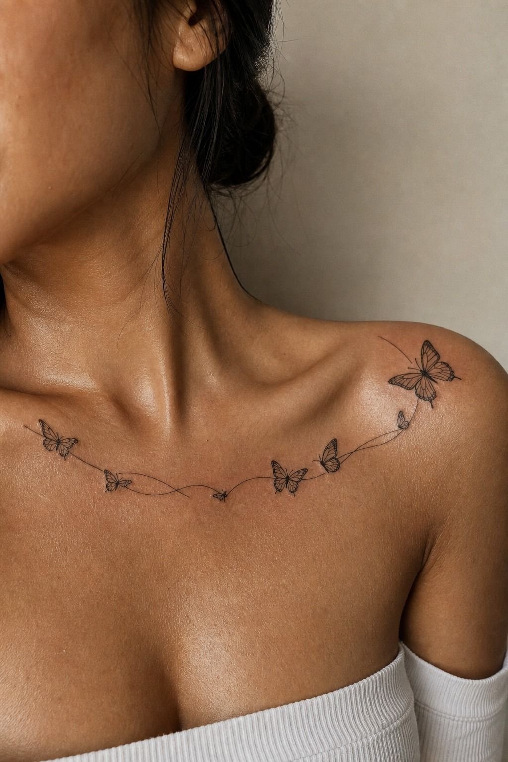 Fine-Line Butterfly Collarbone Tattoos