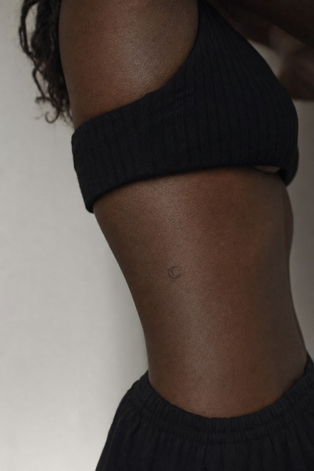 Tiny Crescent Moon Rib Tattoos