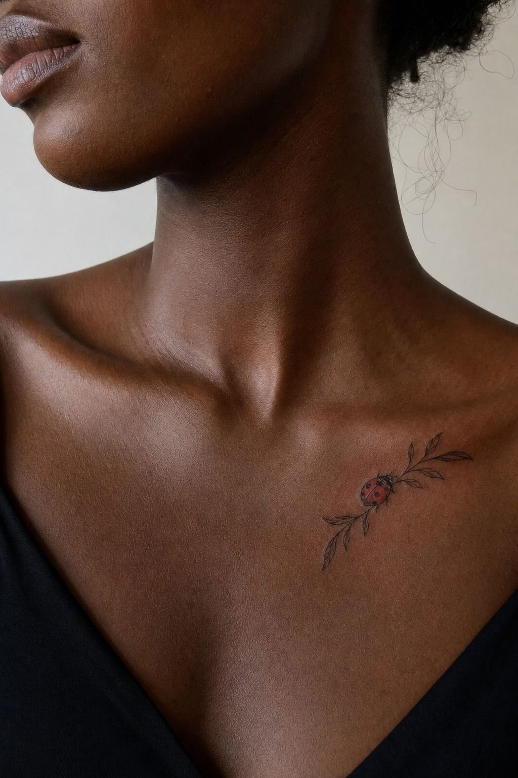 Ladybird Tattoo Along the Collarbone