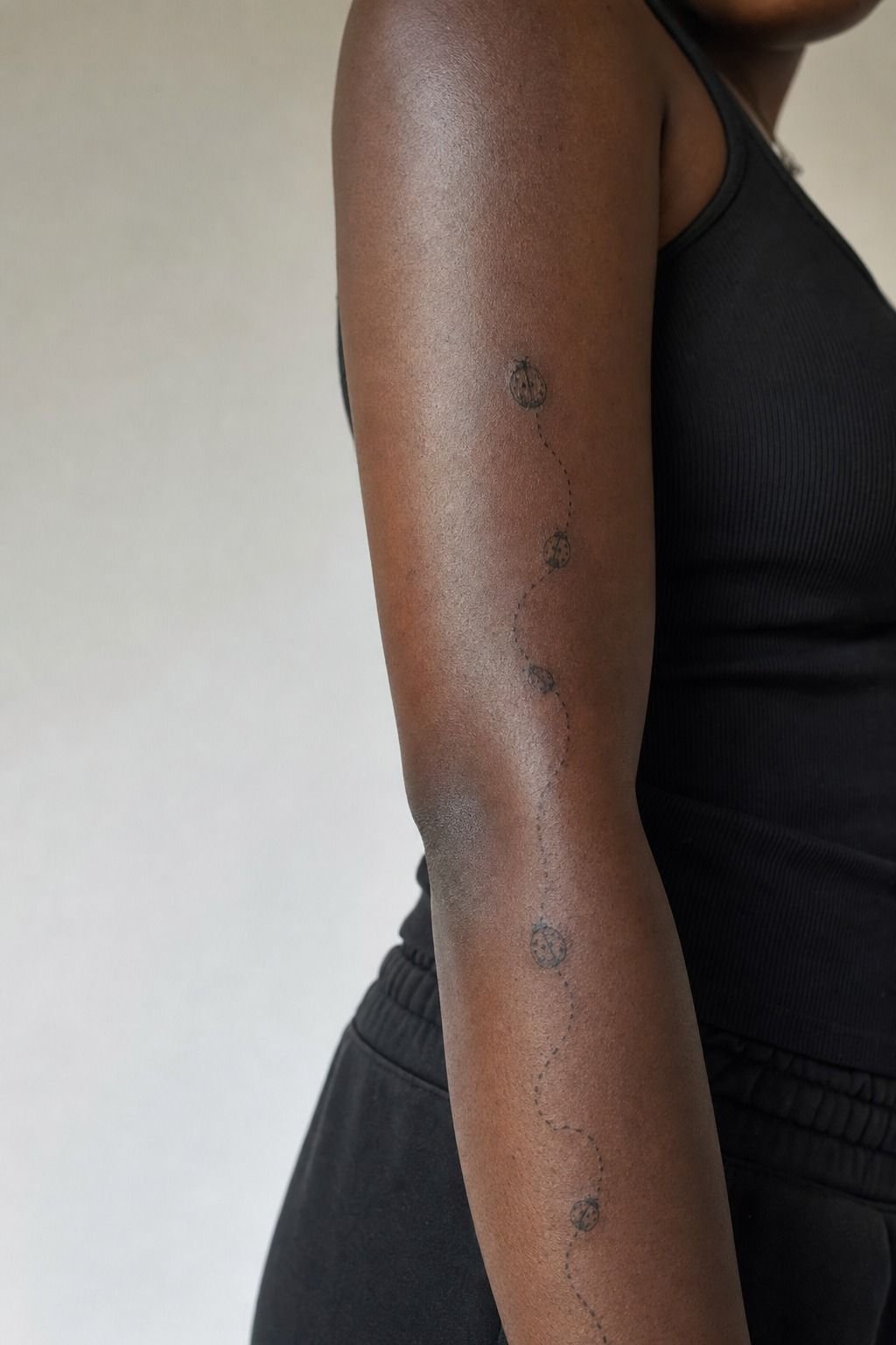 Tiny Ladybug Trail Along the Forearm