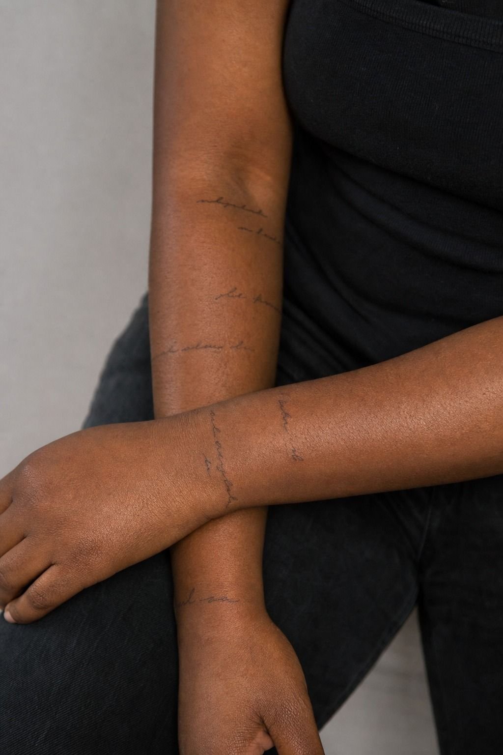Small Handwritten Words Across Two Forearms