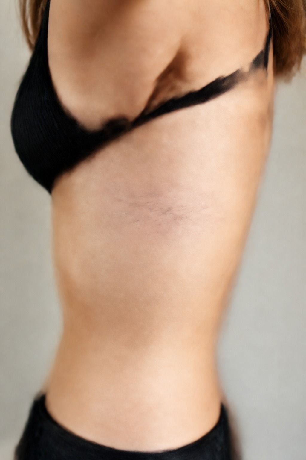 Fine-Line Script Along the Upper Rib