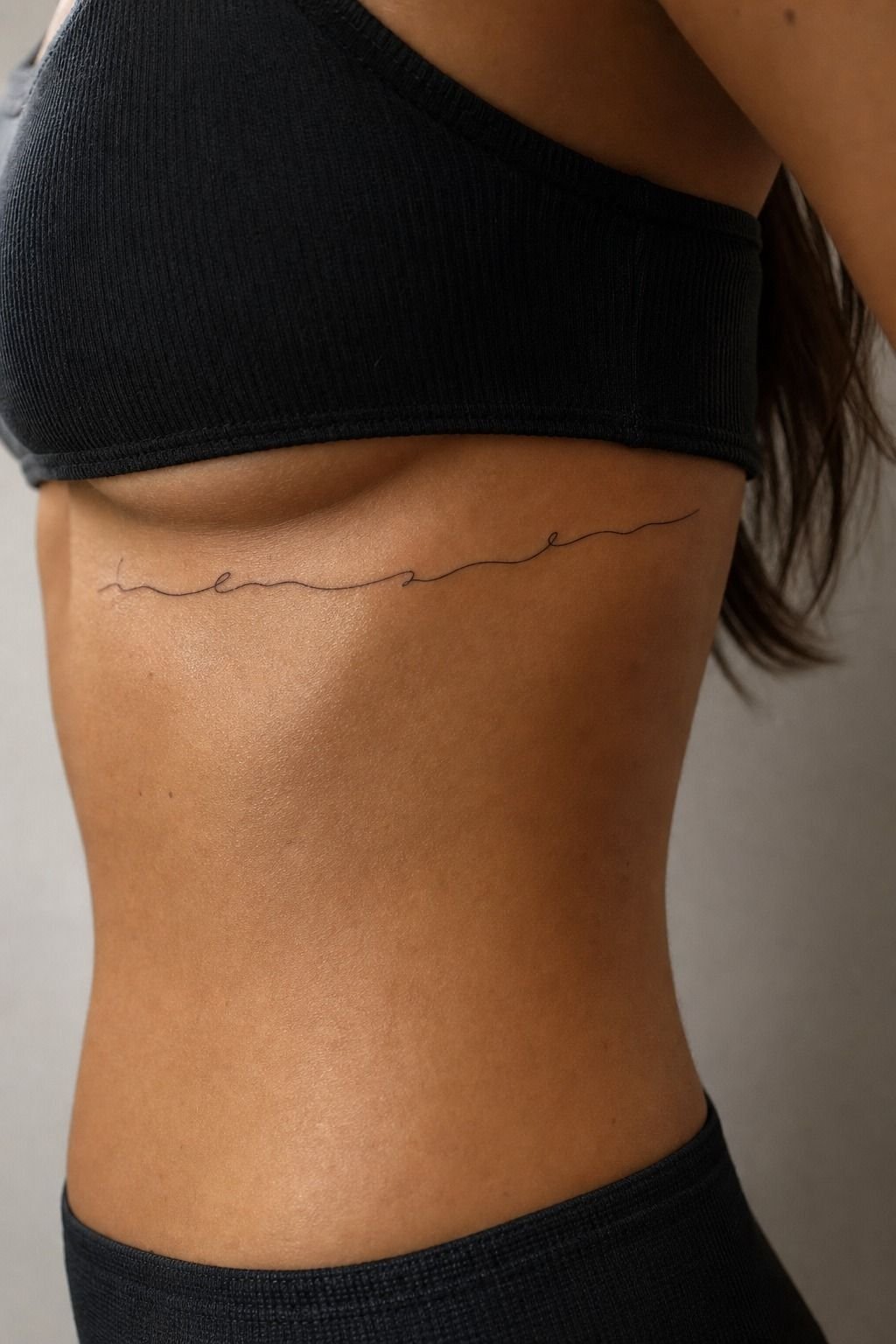 Small Script Tattoo Under the Rib