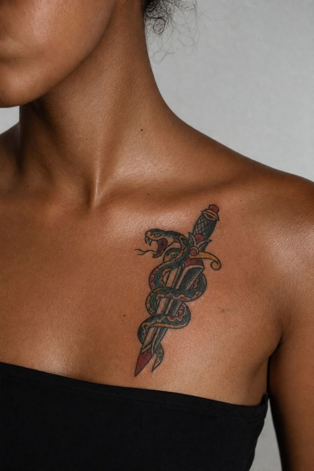 Snake Wrapped Around Dagger Tattoo