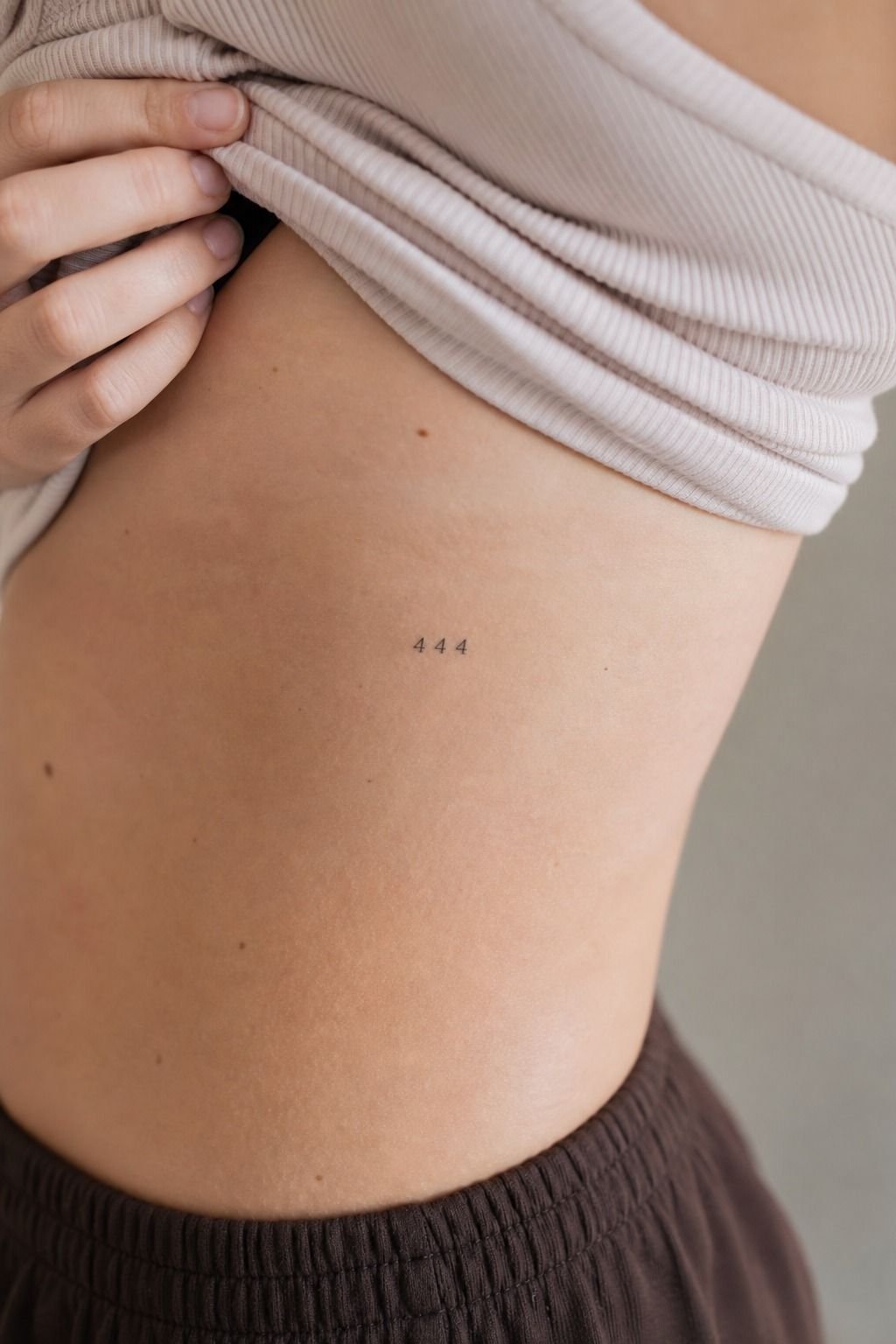 Dainty Angel Number Rib Tattoos