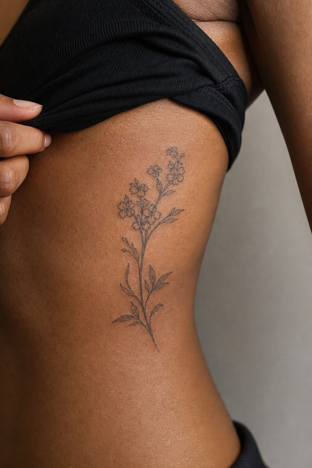 Cute Micro Tattoo Behind the Rib Curve