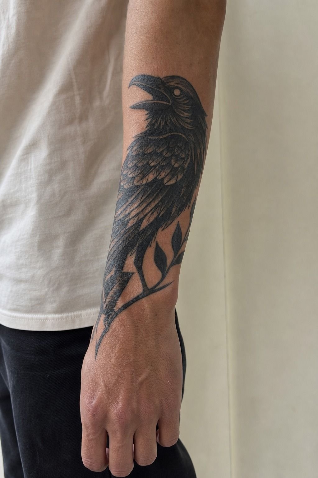 Go Bold With a Blackwork Raven Across the Forearm