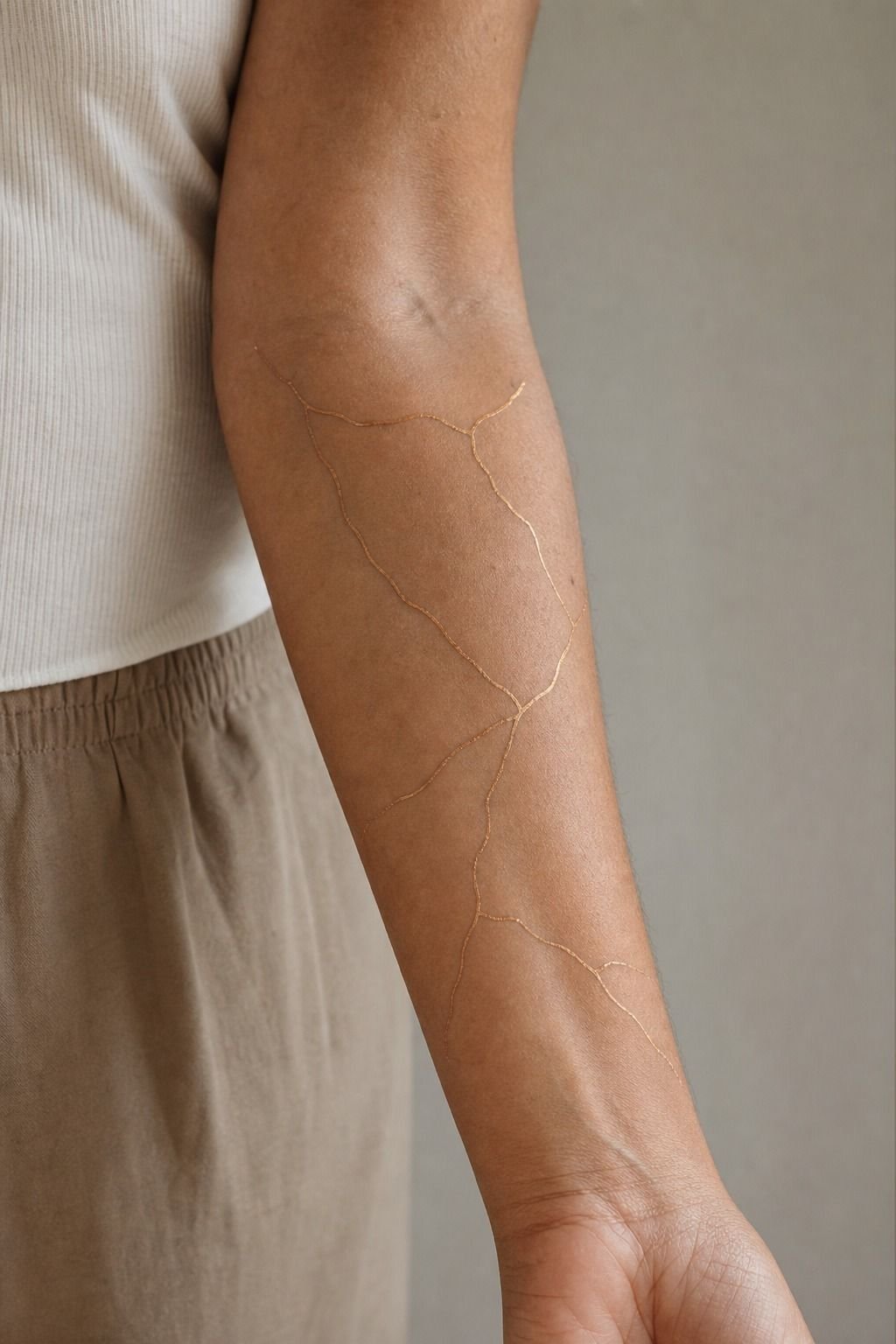 Kintsugi Gold Seams Reworked on the Forearm