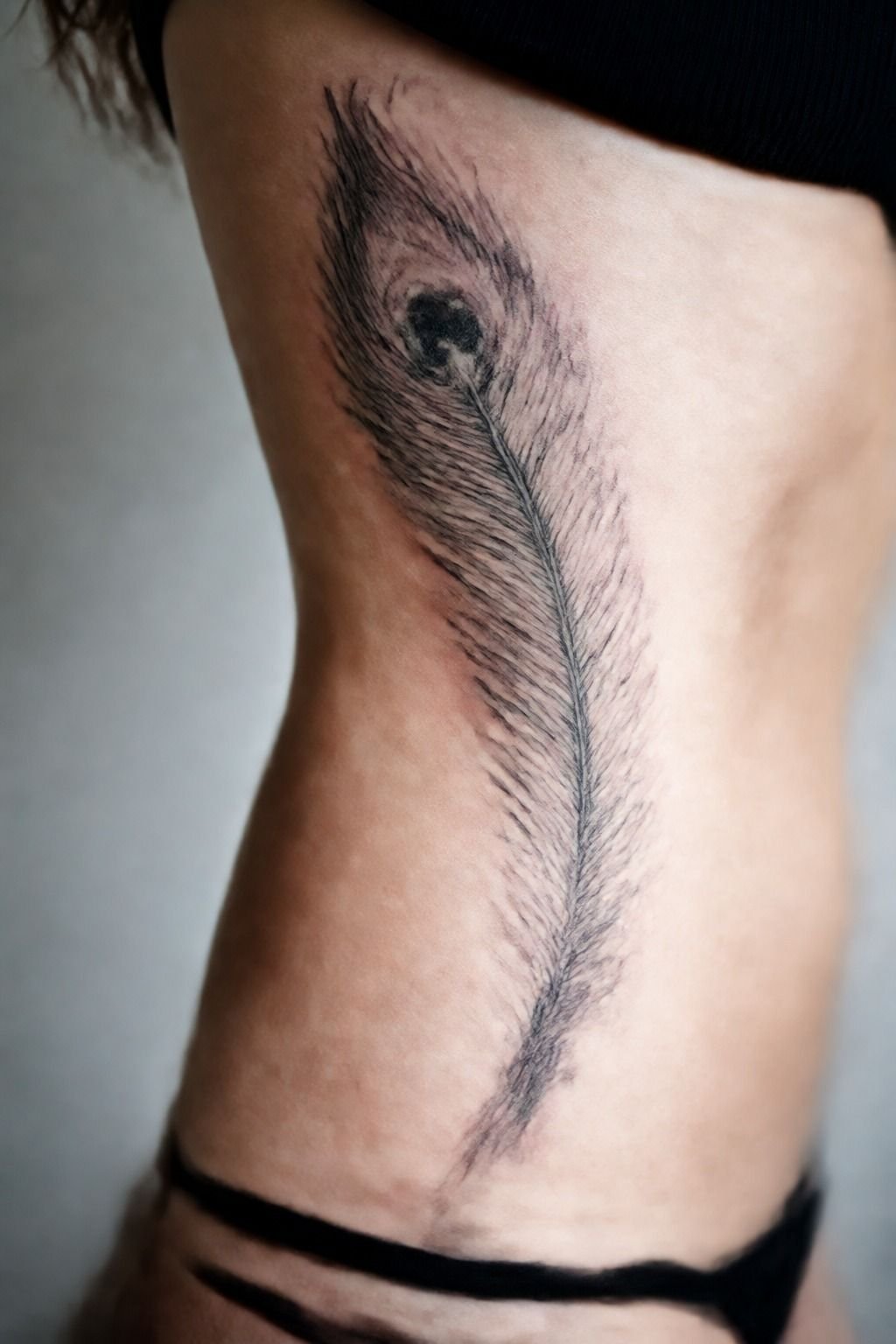 Follow the Ribcage Flow With a Peacock Feather