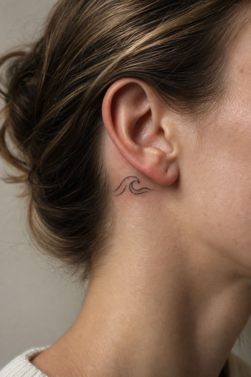 Keep a Minimalist Wave Linework Tattoo Behind the Ear
