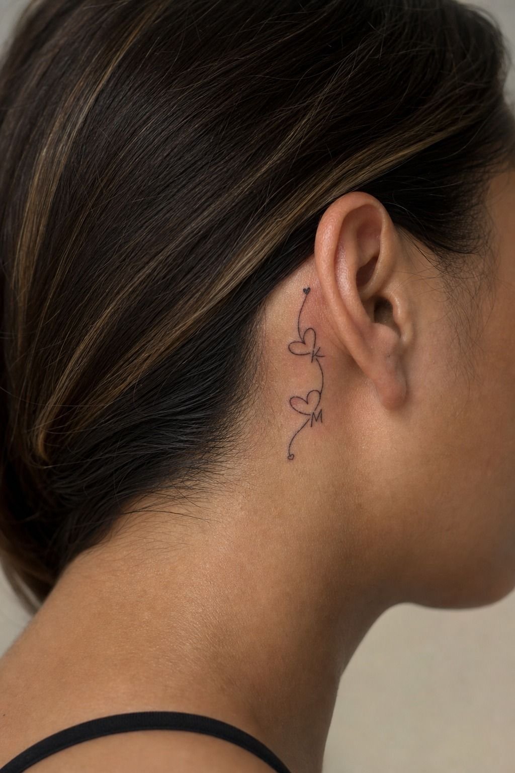 Place Matching Hearts Behind the Ear With Tiny Initials