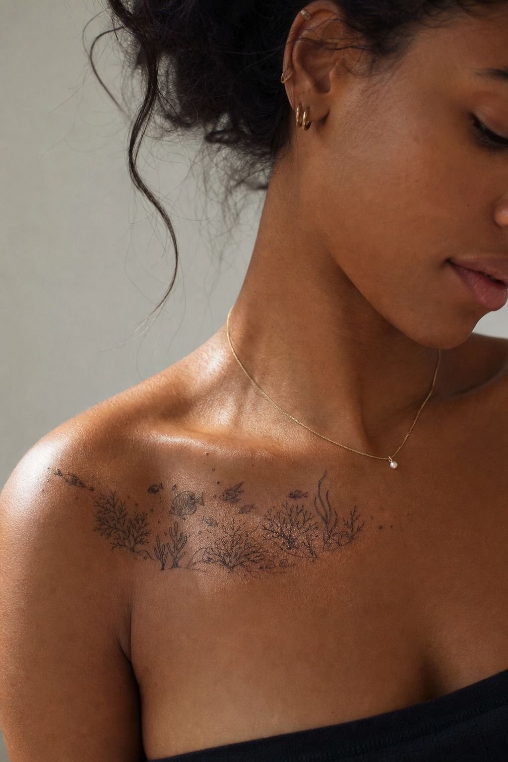 Frame an Underwater Coral Reef Tattoo Along the Collarbone
