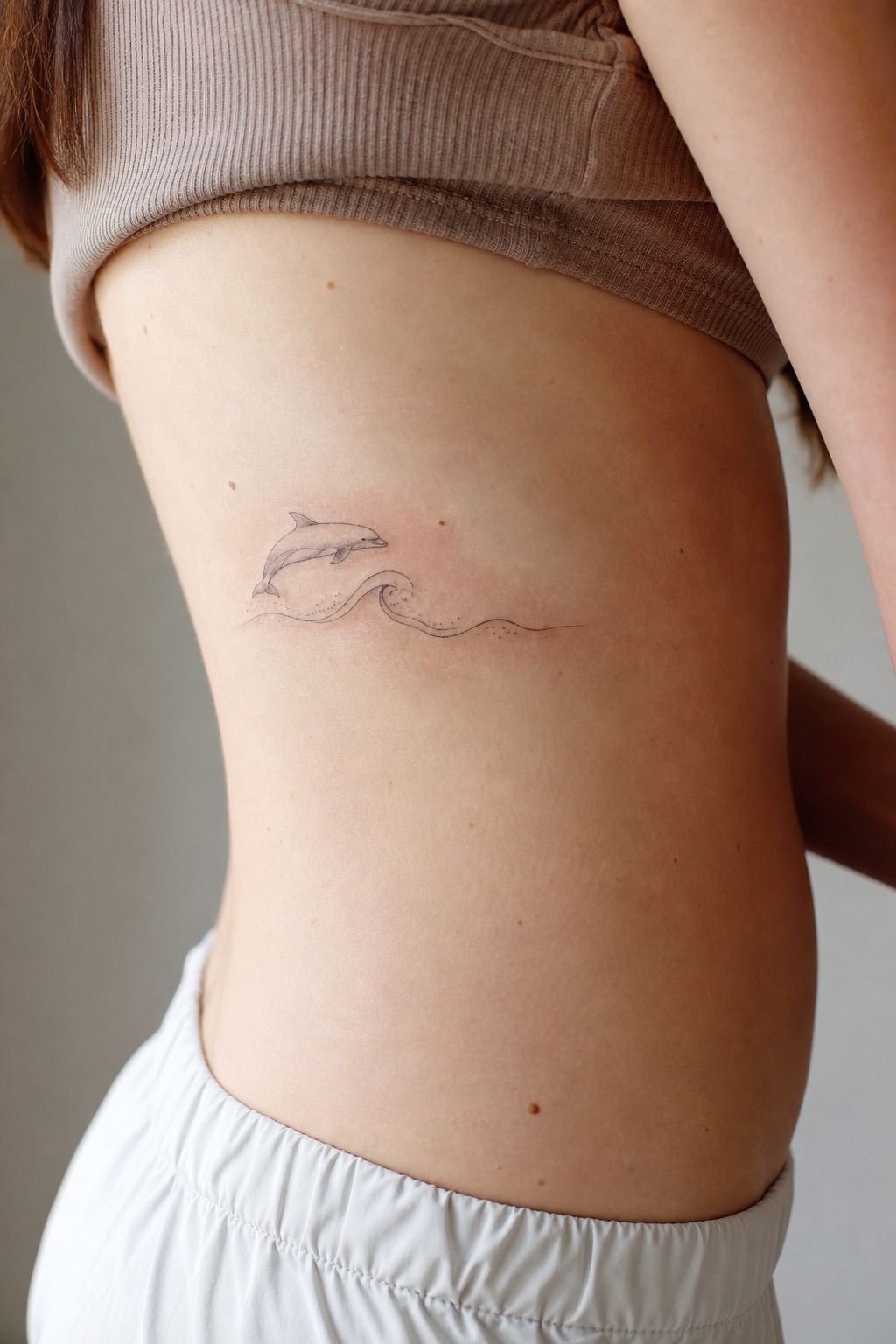 Match Dolphin Wave Tattoos Without Making Them Identical