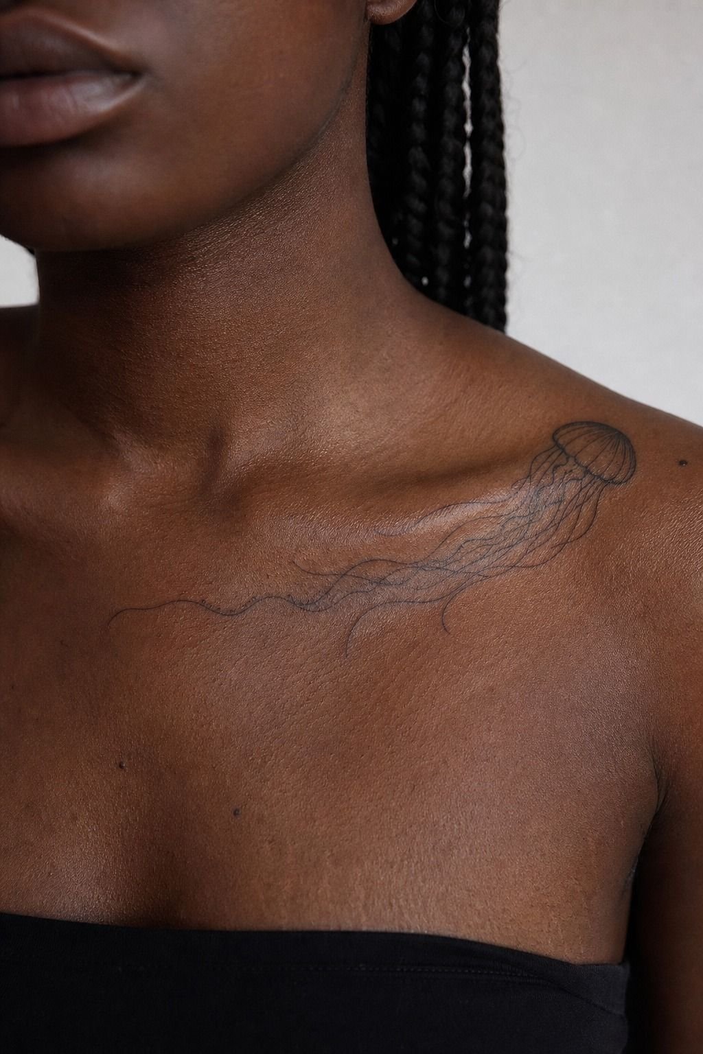 Float a Jellyfish Fine Line Tattoo Along the Collarbone