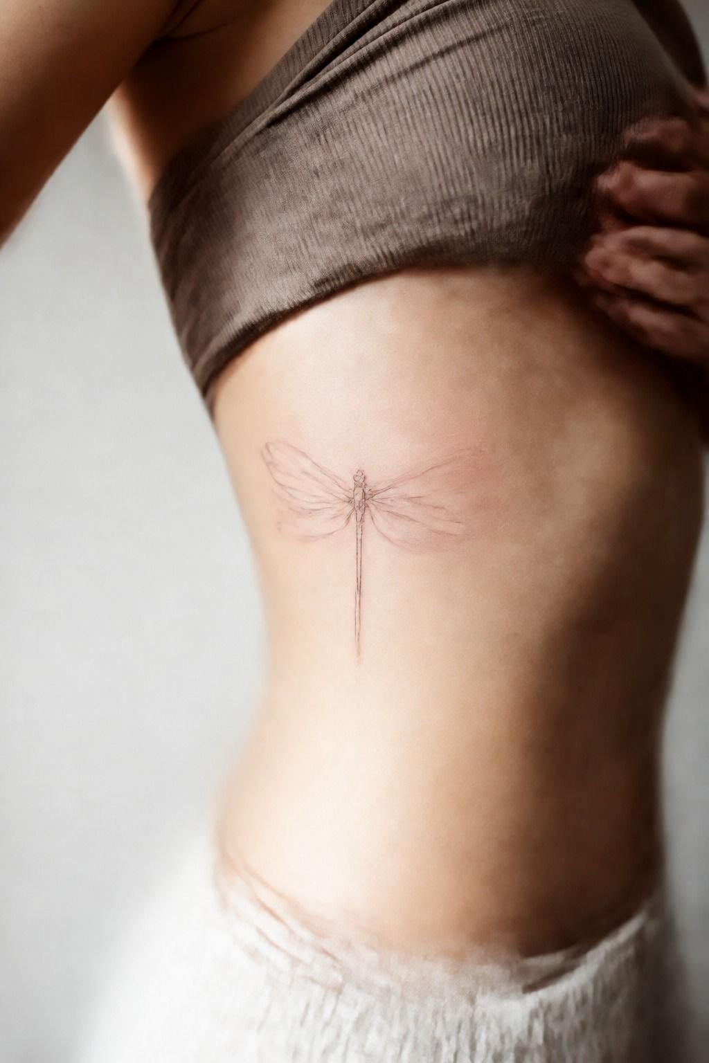Minimalist Single-Line Dragonfly Tattoo