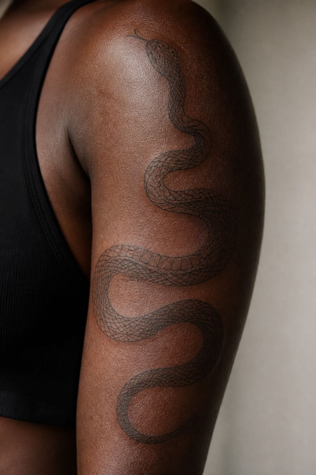 Fine Line Snake Wrapped Around Upper Arm