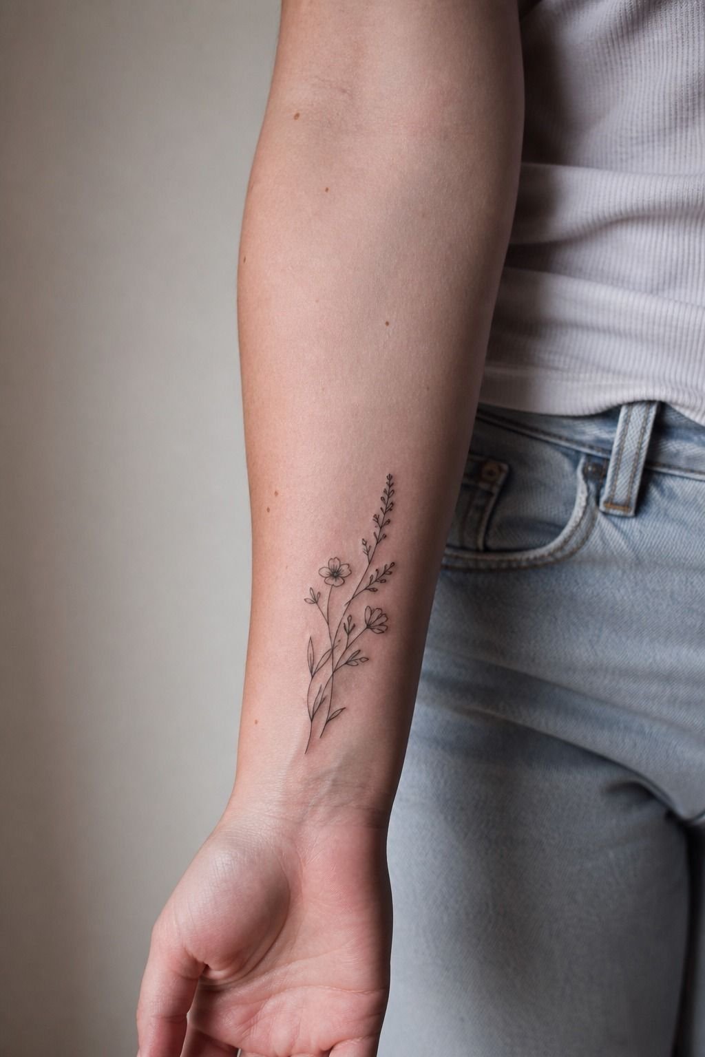 Fine-Line Botanical Front Wrist Tattoos