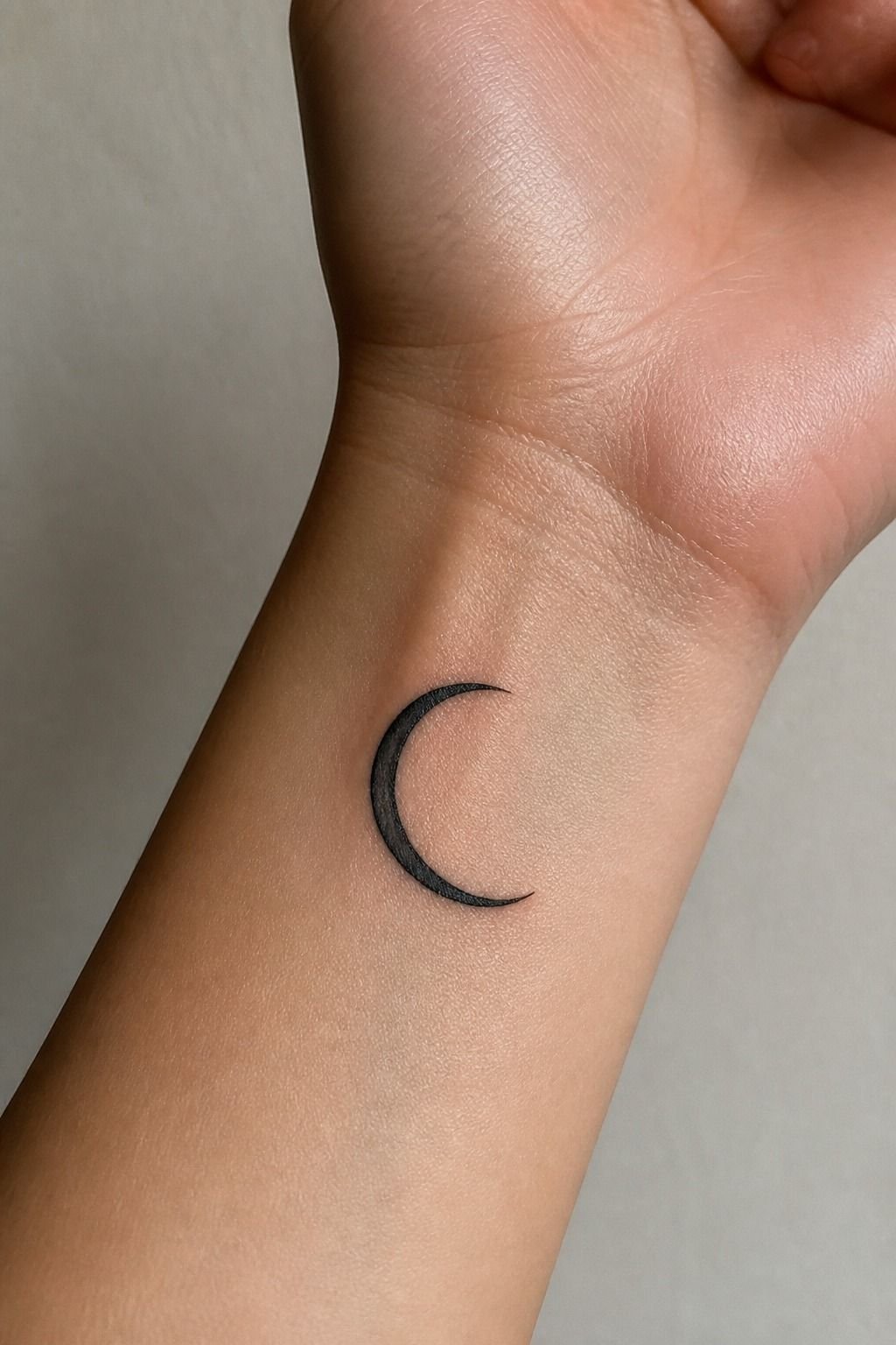 Minimalist Crescent Moon Front Wrist Tattoo