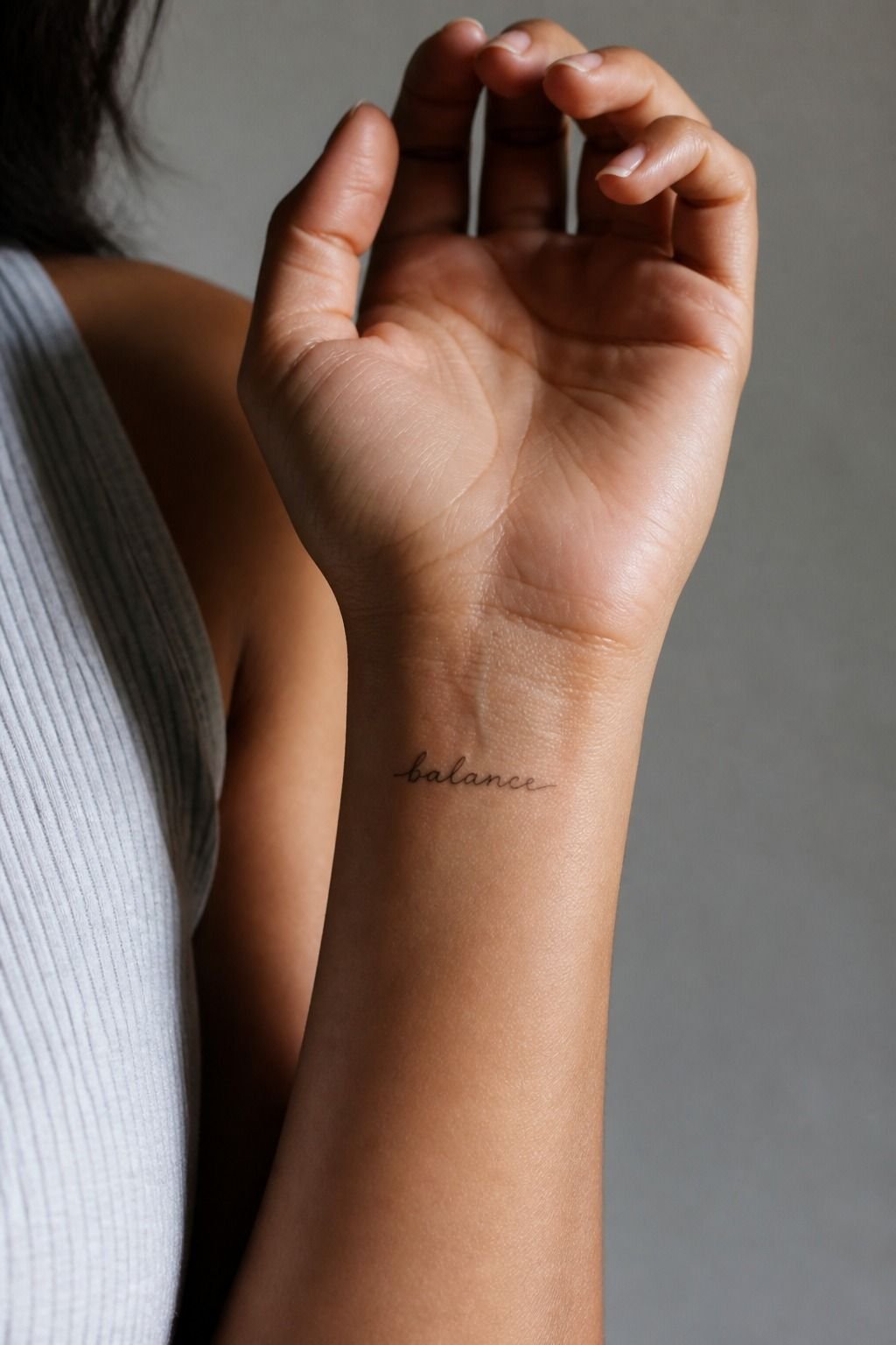 Tiny Script Front Wrist Name Tattoo
