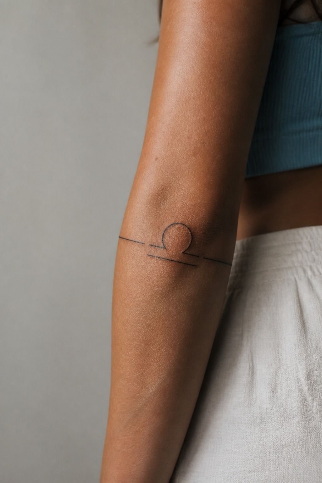 Libra Zodiac Glyph Tattoo Behind the Arm