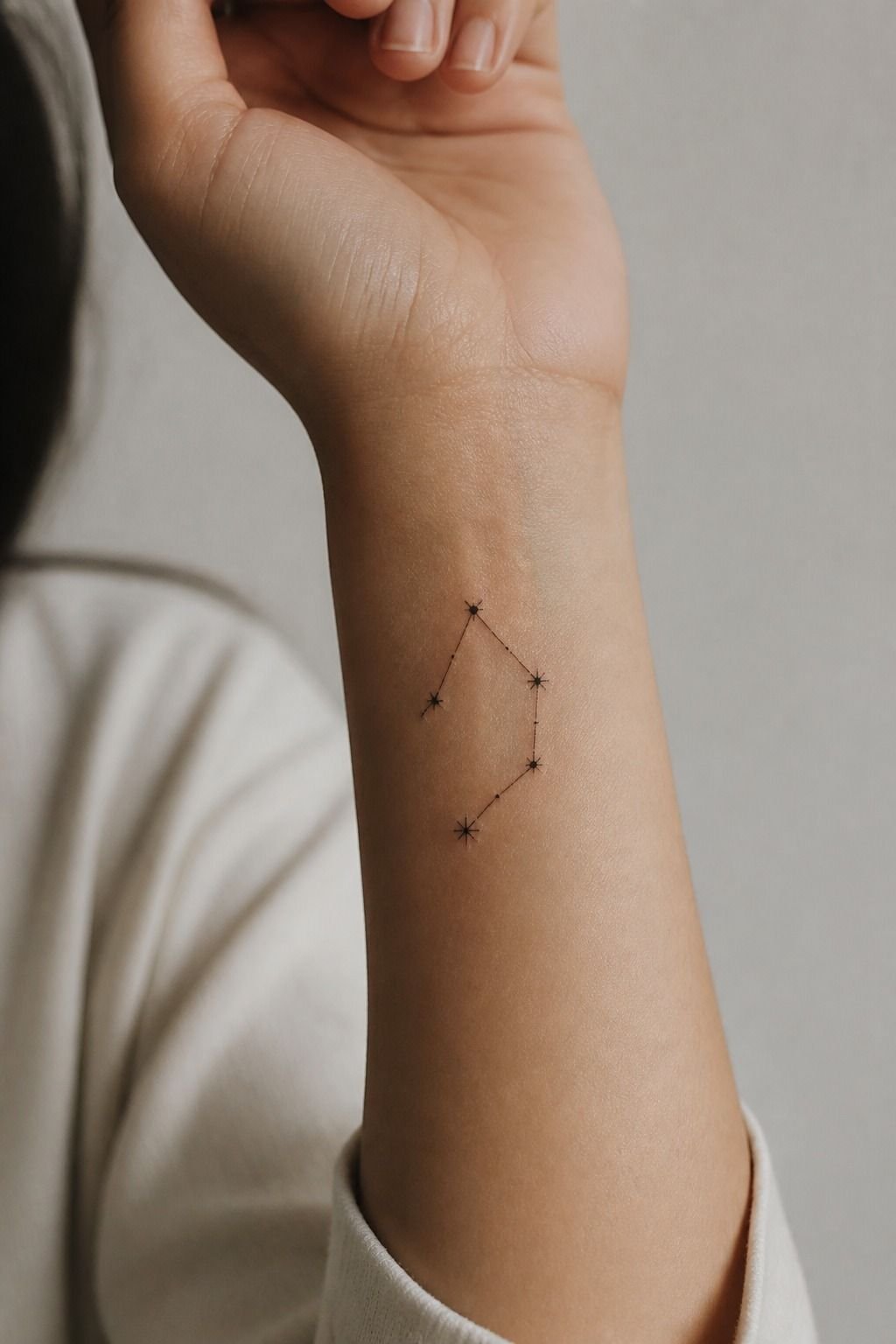 Fine Line Libra Constellation Tattoo on the Wrist