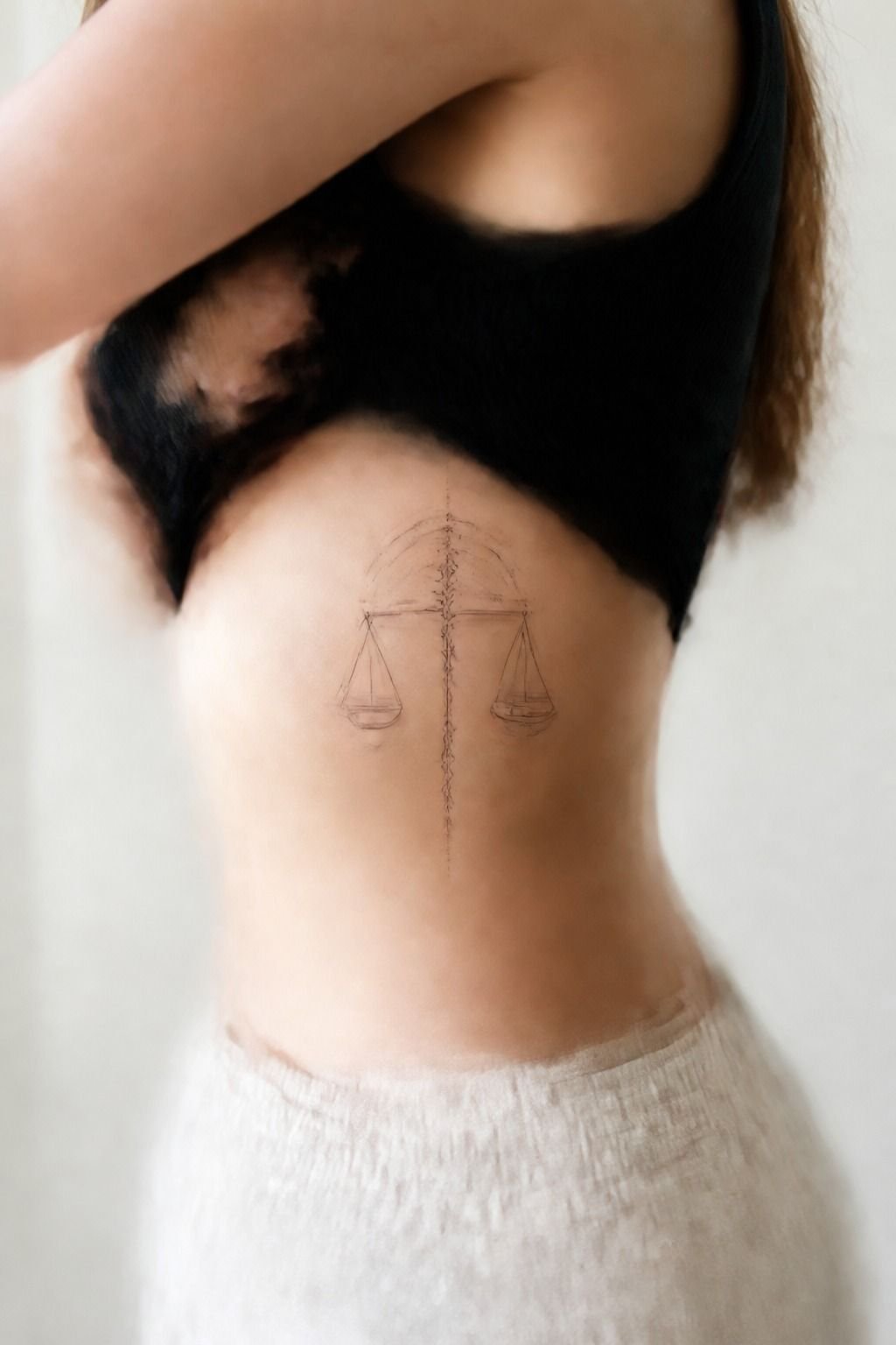 Libra Zodiac Tattoo Across the Ribcage