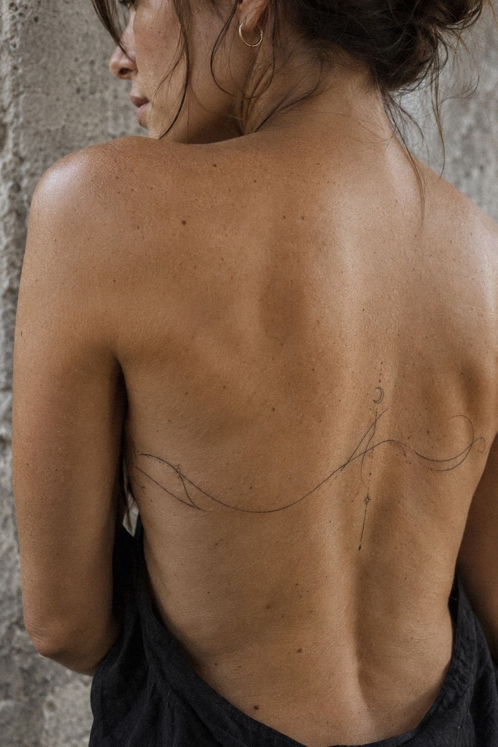 Meaningful Script Along the Back Ribs