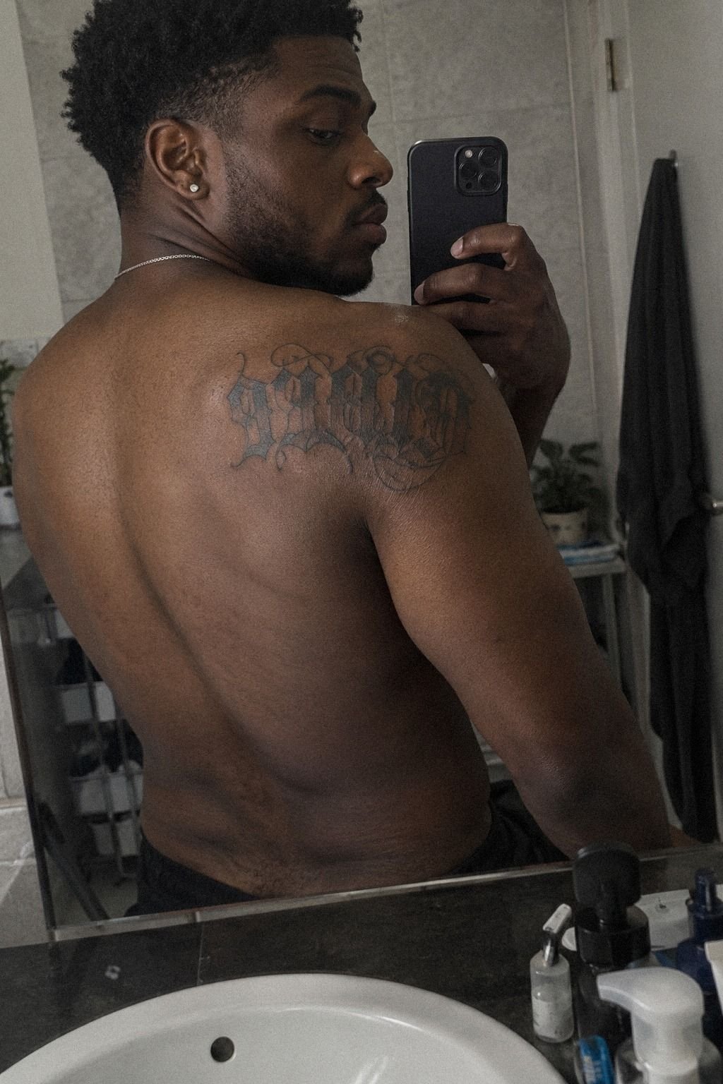 Gothic Script Makes a Fierce Shoulder Statement